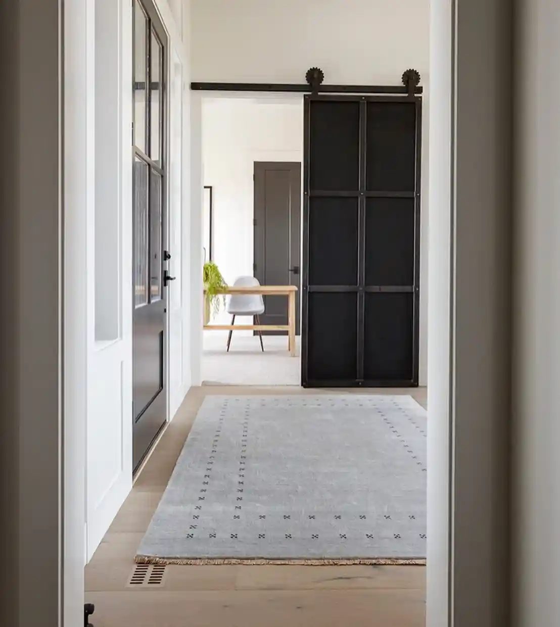 Modern Farmhouse Hallway with Industrial Black Sliding Door idea 2