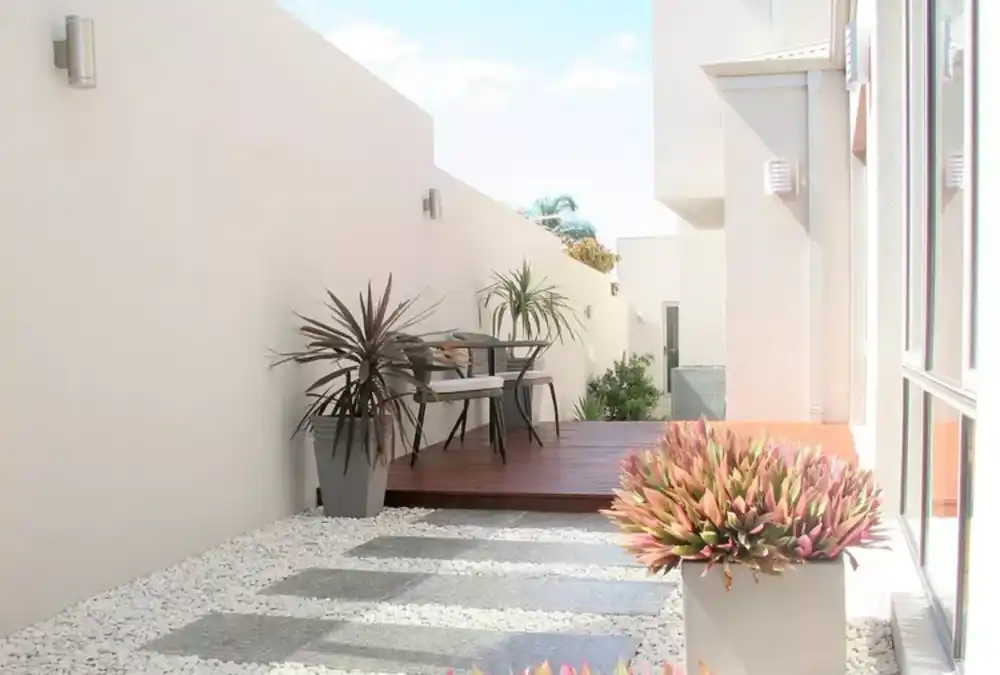 Modern Minimalist Pebble and Paver Retreat – Brightening the Forgotten Corridor