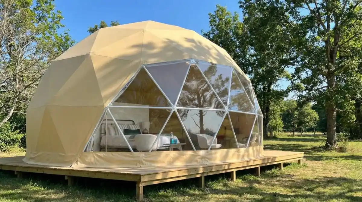 Sun-Drenched Canvas and Crimson Retreat - A Geodesic Dome Bedroom with a View