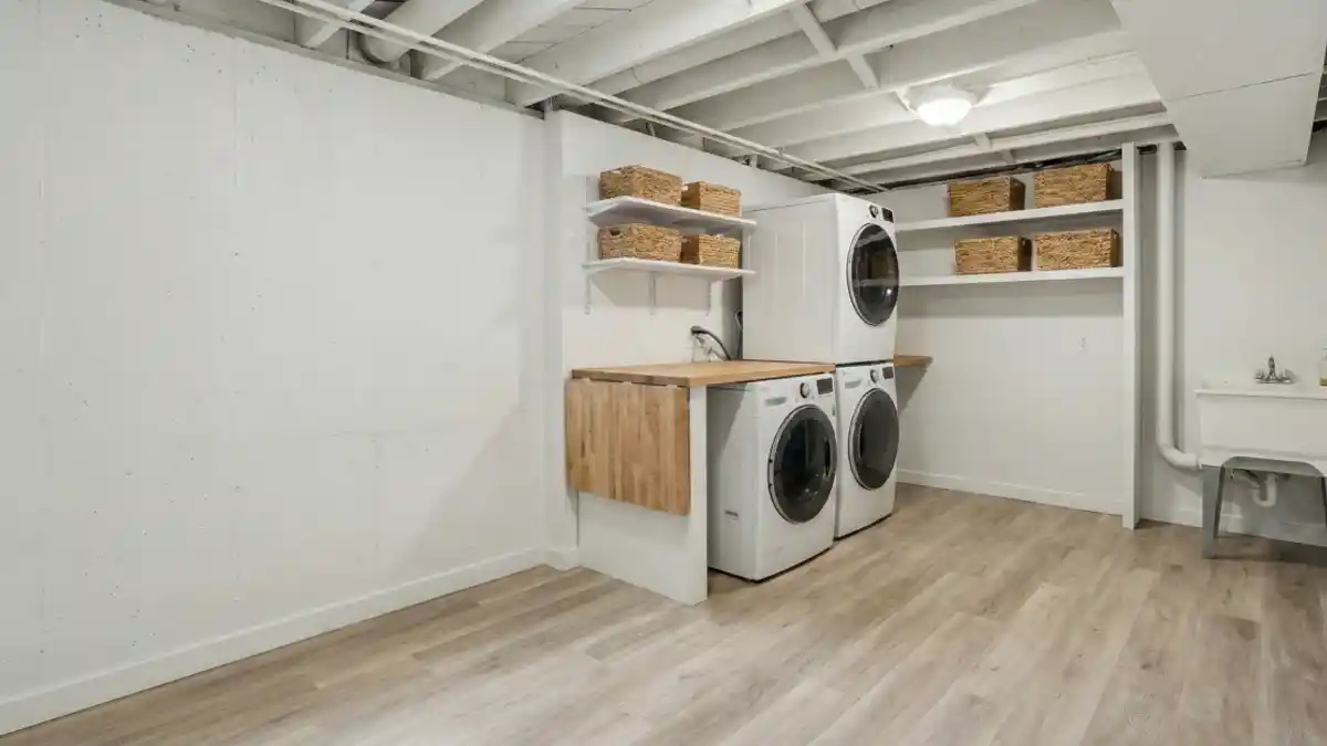 Crisp White Industrial Chic Laundry Room – Turning Concrete into a Clean Slate