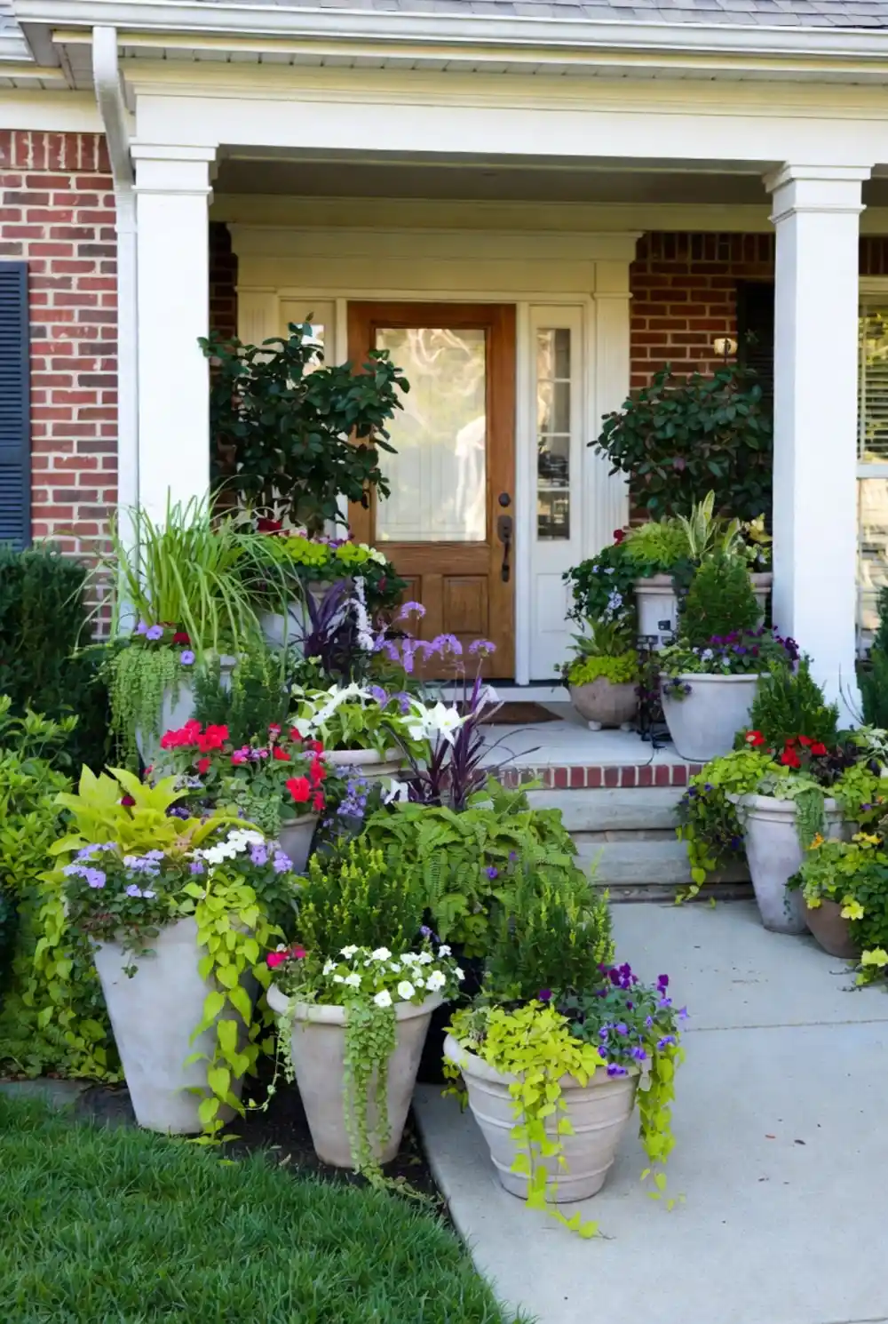 Grand Limestone and Lime Oasis – Overflowing Estate-Style Porch Garden