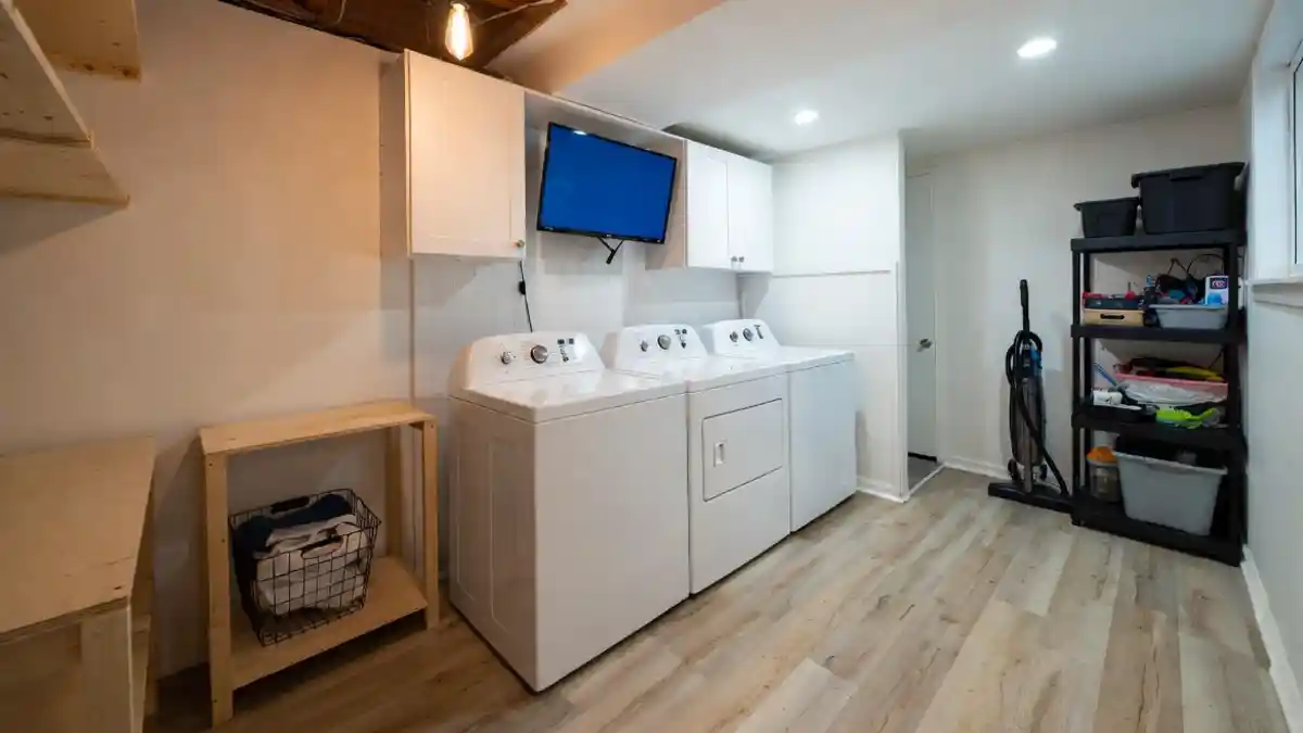 Industrial Wood and Crisp White Laundry Hub – Entertainment Meets Efficiency in a Semi-Finished Space