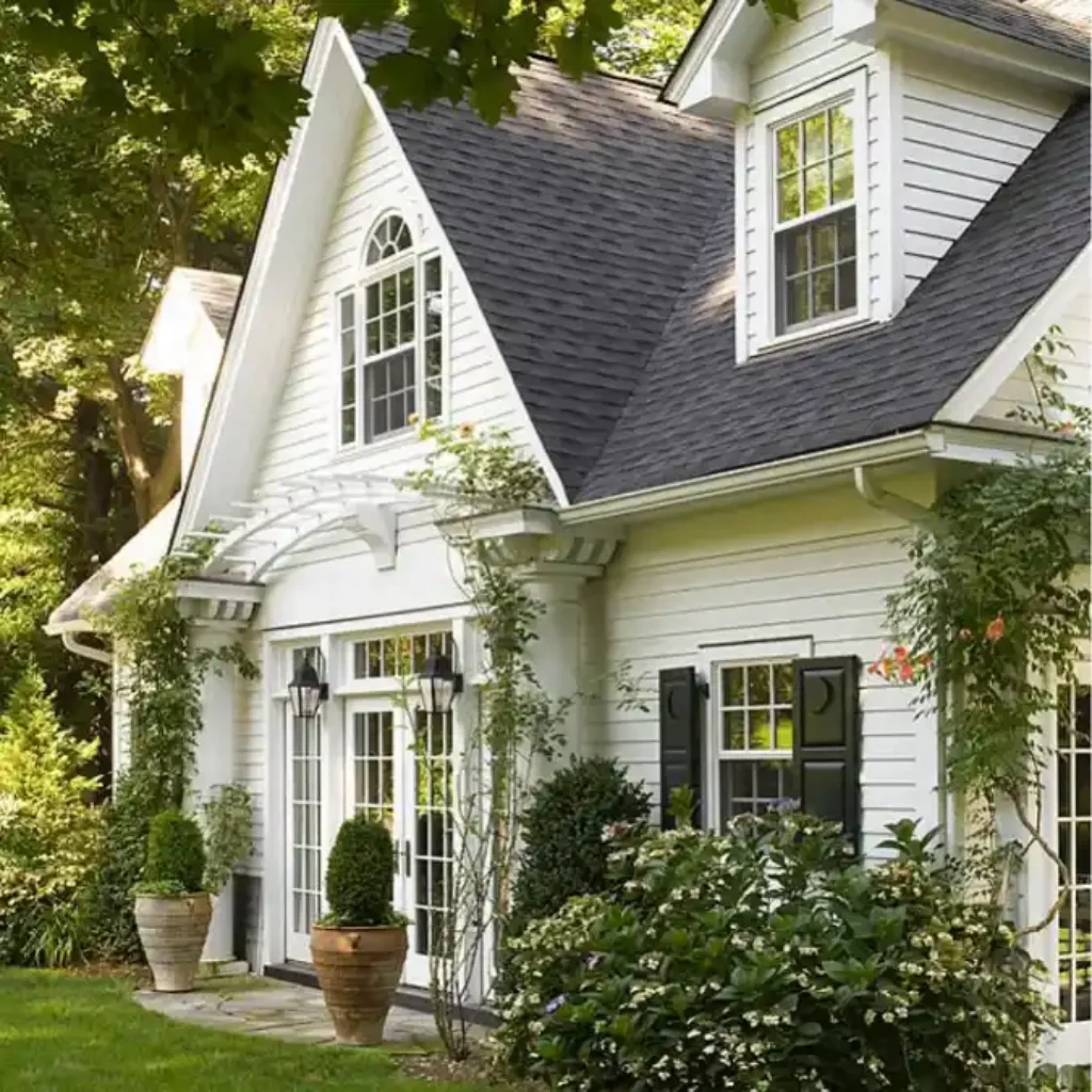 Storybook White Cottage Facade – A Romantic Twist on Modern Medieval Living