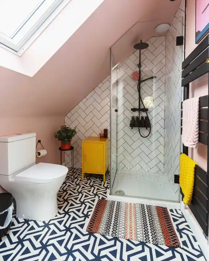 Blush & Bold Geometry - Maximizing Style in a Sloped-Ceiling Bathroom