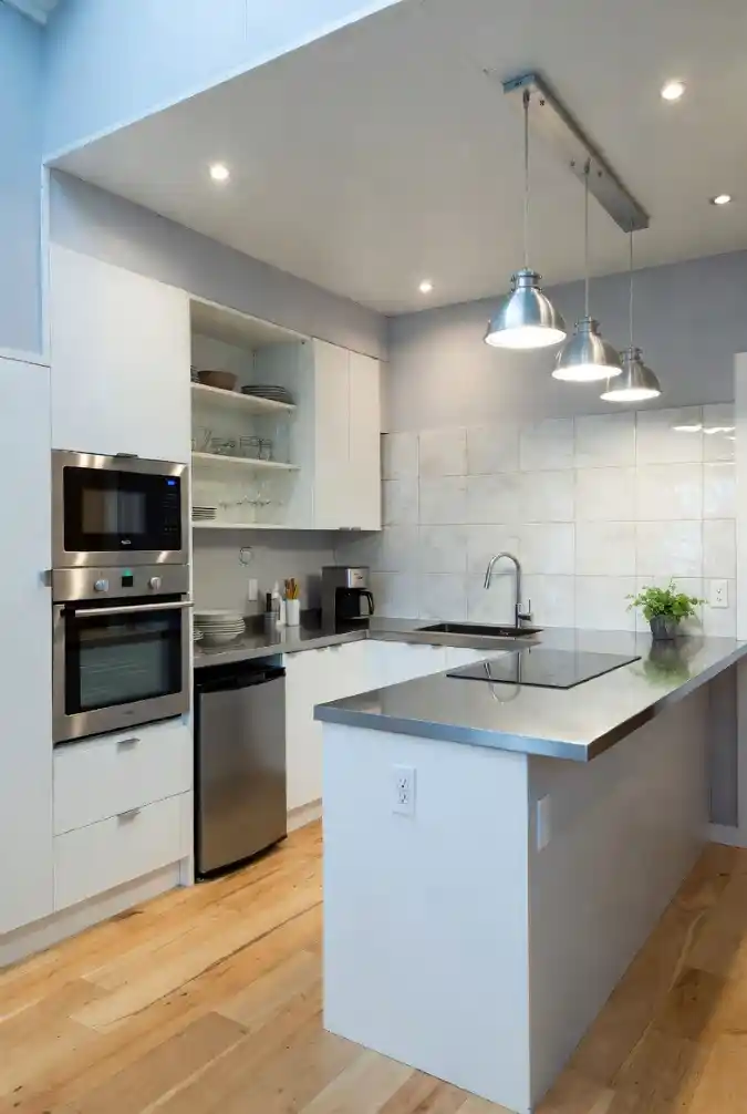 Industrial Chic Minimalism - Tiny Home Kitchen with Sleek Metallic Finishes