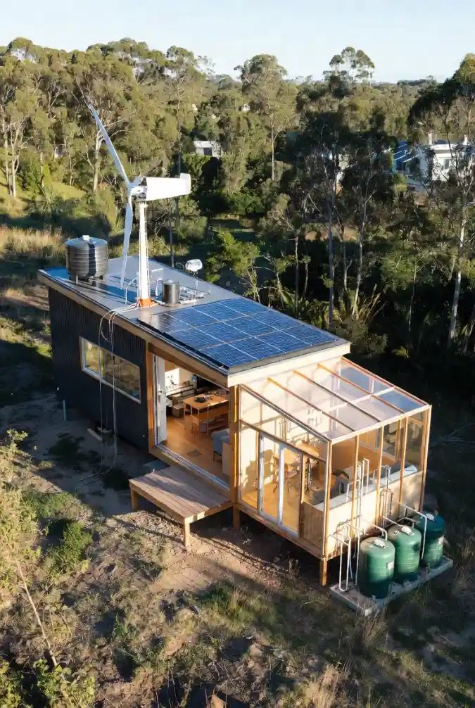 Solar-Powered Sanctuary with a Glass-Enclosed Sunroom - Off-Grid Living Redefined