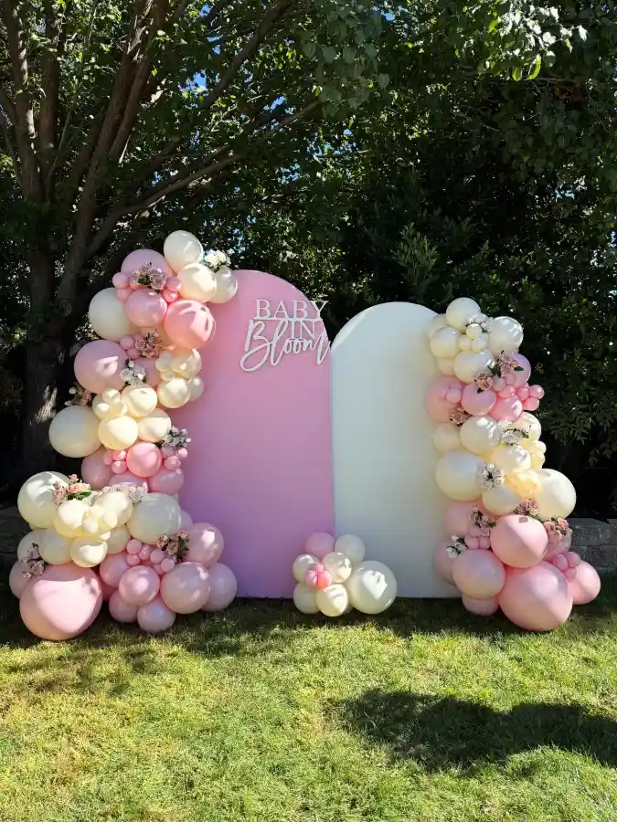 Blushing Petals and Pastel Arches - A Garden-Fresh Backdrop for Her Arrival